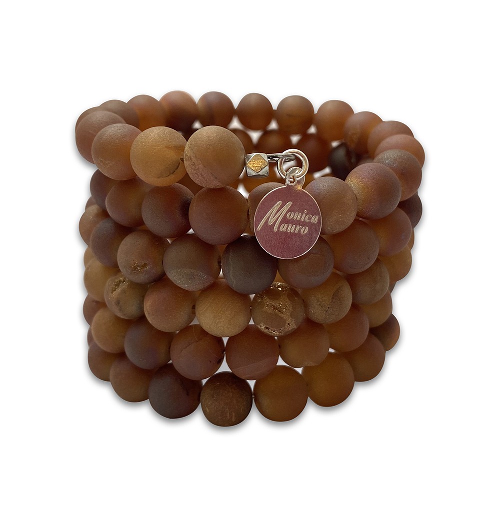 A brown beaded bracelet with a small round tag.