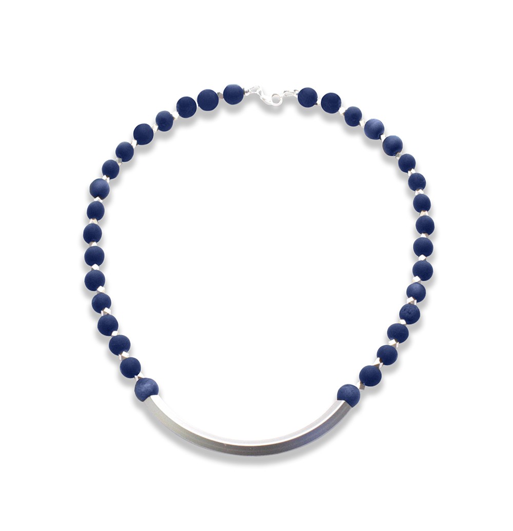 A necklace with dark blue round beads and a curved silver centerpiece.