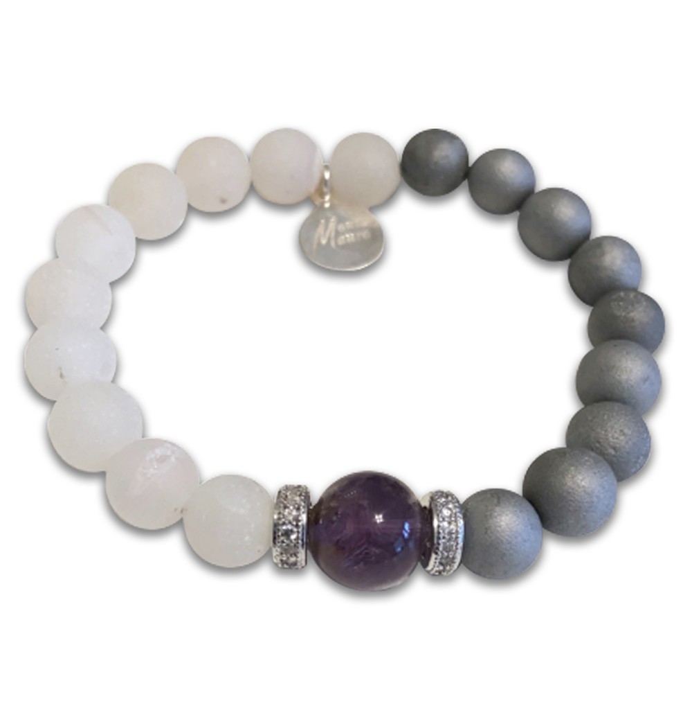 A beaded bracelet with white, gray, and a central purple stone.