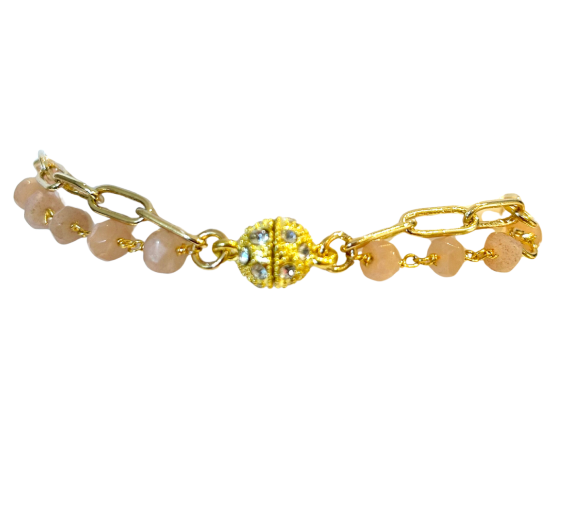A gold and pink beaded bracelet with a decorative clasp.