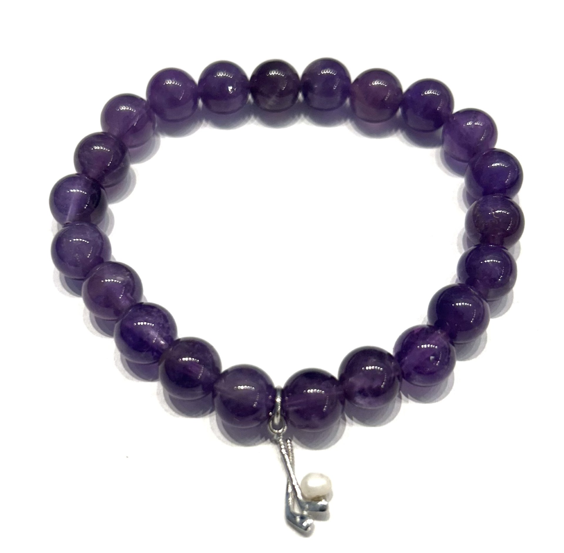A purple beaded bracelet with a silver charm.