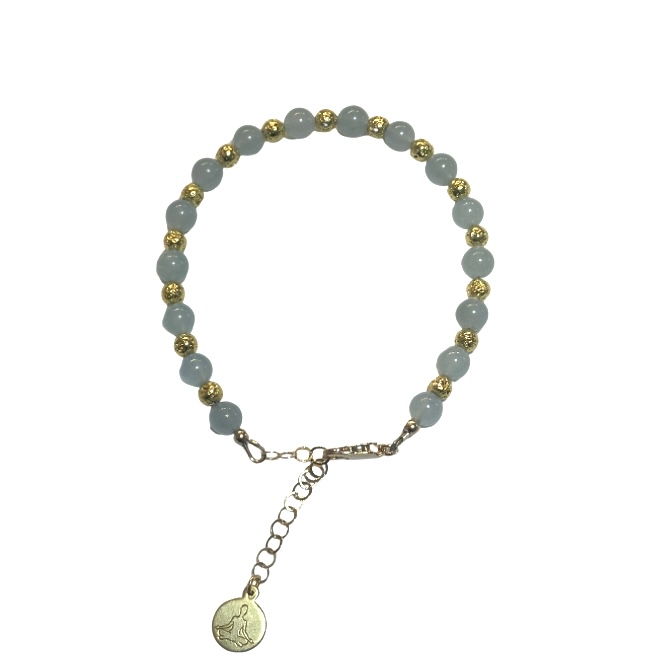 A beaded bracelet with a charm and adjustable chain.