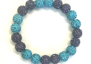 Blue and purple beaded bracelet on display.